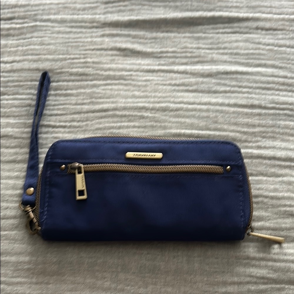 Travelon dark blue wristlet with RFID blocking technology.